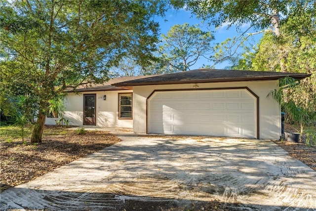 single story home featuring a garage