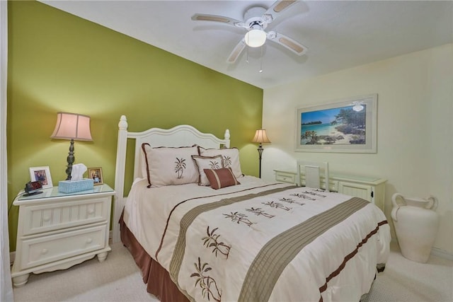 bedroom with ceiling fan and light colored carpet