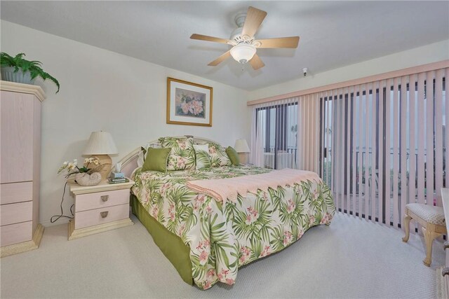 carpeted bedroom featuring ceiling fan and access to exterior