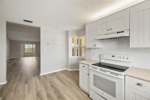 kitchen with white cabinetry, tasteful backsplash, a textured ceiling, white electric stove, and light wood-type flooring