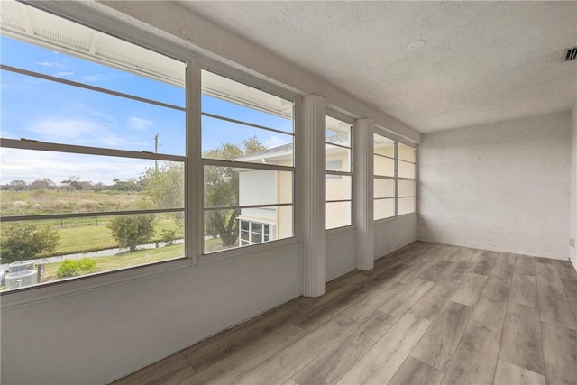 unfurnished sunroom with a healthy amount of sunlight