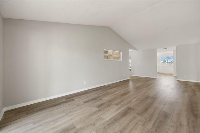 unfurnished living room with lofted ceiling and light hardwood / wood-style floors