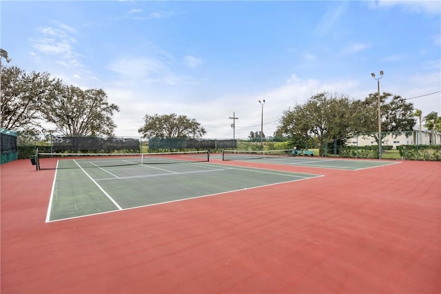 view of sport court with basketball hoop