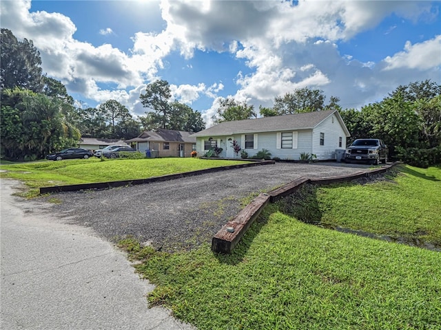 ranch-style home with a front yard