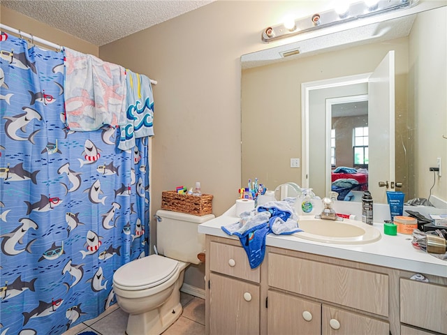 bathroom featuring a shower with curtain, tile patterned floors, a textured ceiling, toilet, and vanity