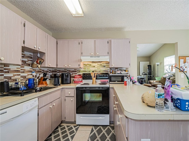 kitchen featuring a textured ceiling, white appliances, tasteful backsplash, and light tile patterned flooring