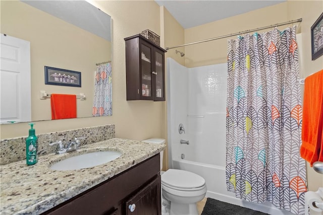 full bathroom with shower / bathtub combination with curtain, vanity, and toilet