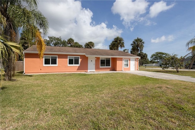 1203 Linmoor Cir NE, Palm Bay, FL 32907 - ranch-style house featuring driveway and stucco siding