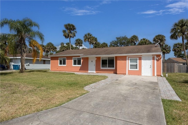 1203 Linmoor Cir NE, Palm Bay, FL 32907 - ranch-style house featuring concrete driveway and stucco siding