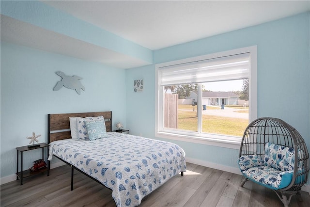 1203 Linmoor Cir NE, Palm Bay, FL 32907 - bedroom with wood finished floors and baseboards
