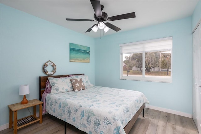 1203 Linmoor Cir NE, Palm Bay, FL 32907 - bedroom with wood finished floors, baseboards, a closet, and a ceiling fan