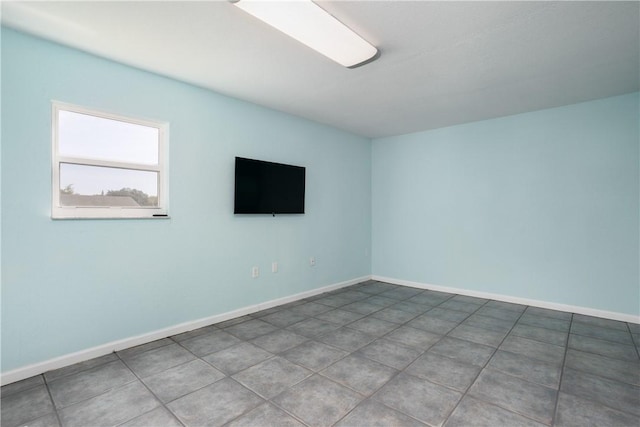 1203 Linmoor Cir NE, Palm Bay, FL 32907 - spare room featuring baseboards