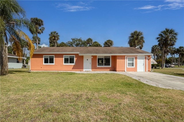 1203 Linmoor Cir NE, Palm Bay, FL 32907 - ranch-style home with a front lawn and stucco siding