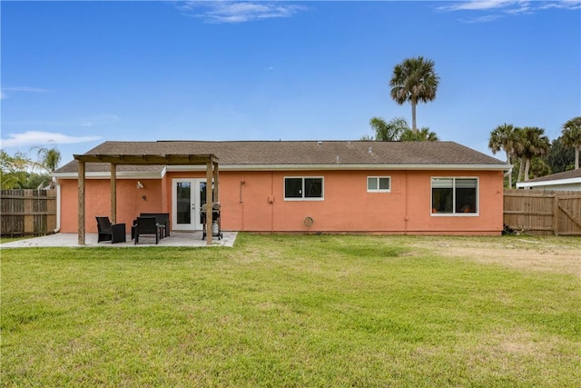 1203 Linmoor Cir NE, Palm Bay, FL 32907 - back of property with a patio area, stucco siding, and french doors