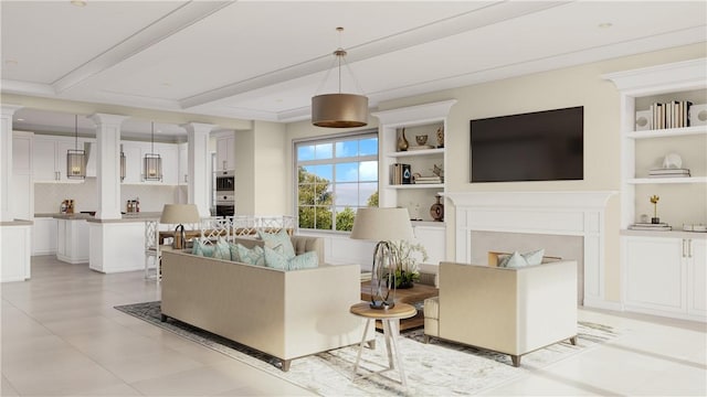 living room with beam ceiling, built in features, a fireplace, and ornate columns