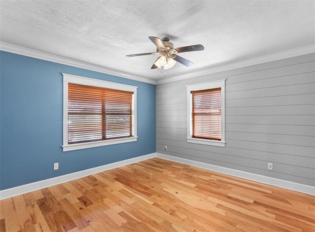 unfurnished room with crown molding, hardwood / wood-style floors, and a textured ceiling