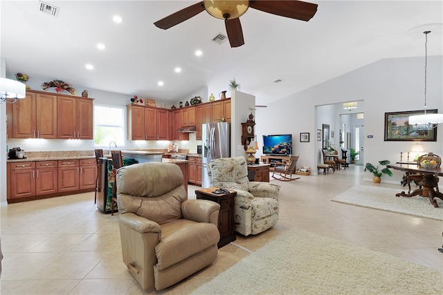 living room with ceiling fan, light tile patterned floors, sink, and high vaulted ceiling