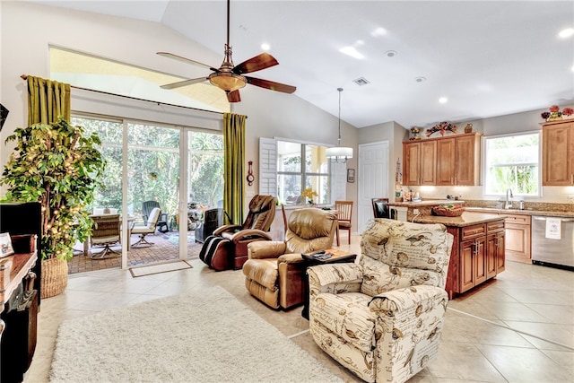 living room featuring light tile patterned floors, vaulted ceiling, and ceiling fan