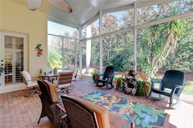 sunroom / solarium with vaulted ceiling