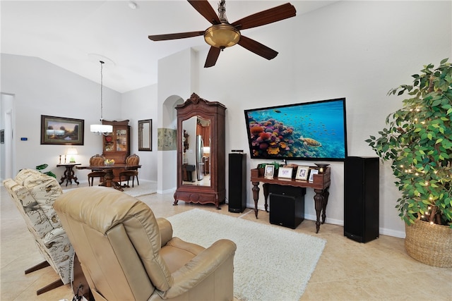 tiled living room featuring ceiling fan and lofted ceiling