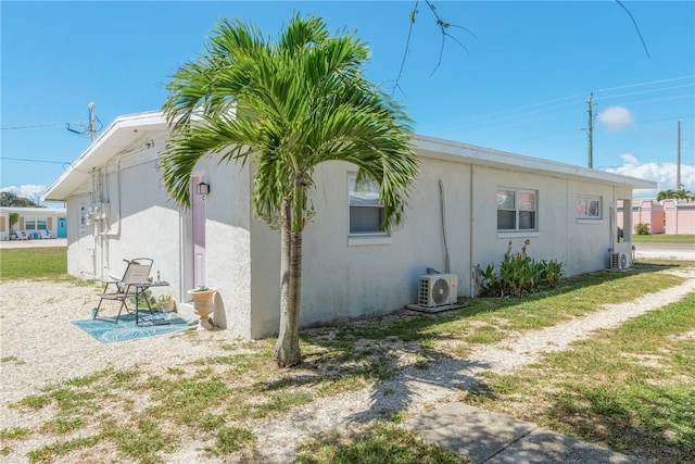 681 S Orlando Ave, Cocoa Beach, FL 32931 - view of property exterior featuring a cooling unit and stucco siding