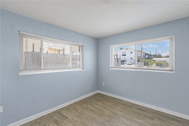 empty room featuring hardwood / wood-style flooring