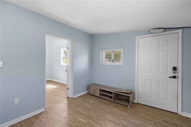 673 S Orlando Ave, Cocoa Beach, FL 32931 - foyer with wood finished floors and baseboards