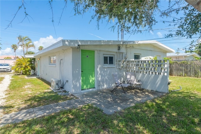 673 S Orlando Ave, Cocoa Beach, FL 32931 - back of house featuring a patio area and a cooling unit