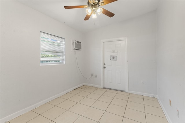 673 S Orlando Ave, Cocoa Beach, FL 32931 - unfurnished room featuring baseboards, a ceiling fan, and a wall mounted air conditioner