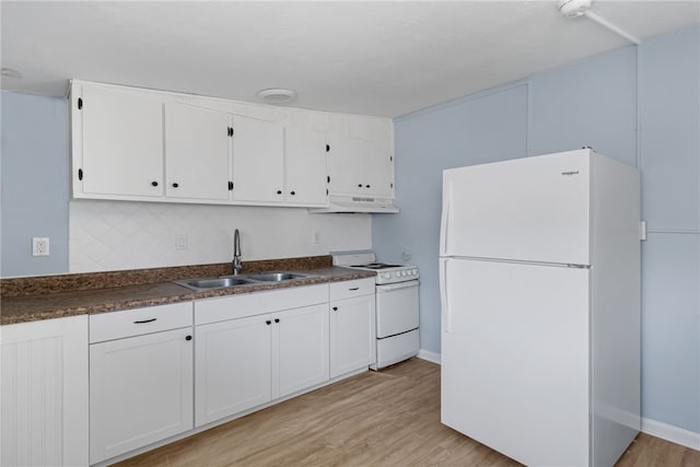 673 S Orlando Ave, Cocoa Beach, FL 32931 - kitchen with white appliances, a sink, under cabinet range hood, light wood-type flooring, and white cabinets
