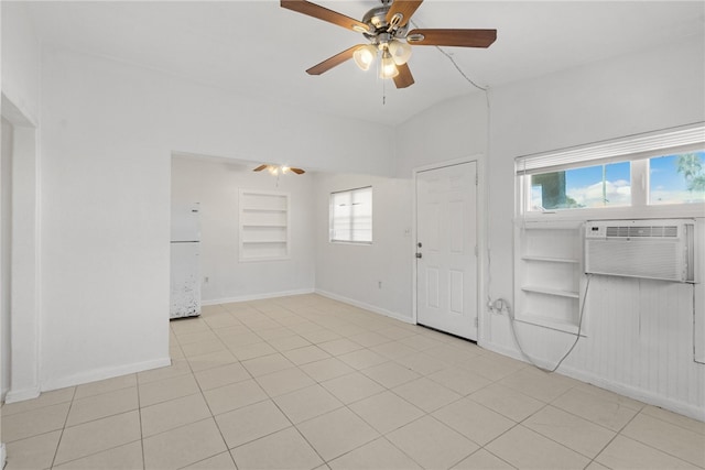 673 S Orlando Ave, Cocoa Beach, FL 32931 - spare room featuring a ceiling fan, baseboards, healthy amount of natural light, and light tile patterned flooring