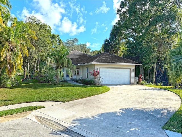 ranch-style home with a front yard and a garage