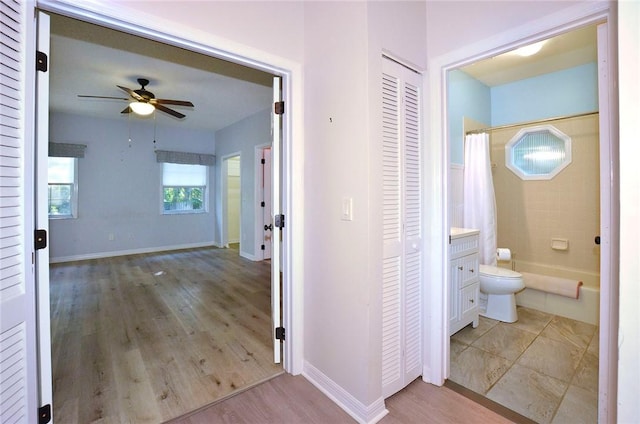 hall with light wood-type flooring