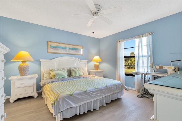 bedroom featuring ceiling fan and light wood-type flooring