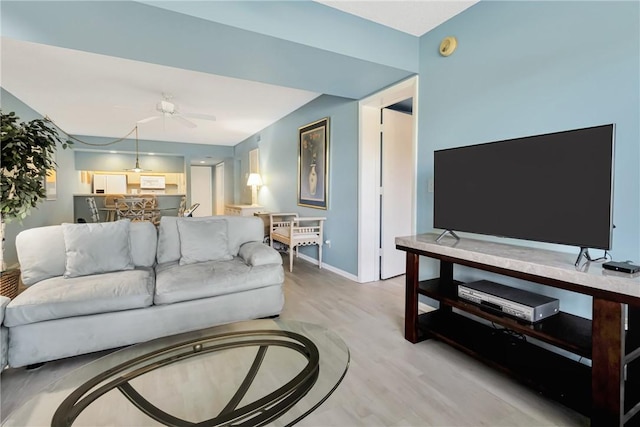 29 Plantation Dr Unit 202, Vero Beach, FL 32966 - living area with a ceiling fan, light wood finished floors, and baseboards