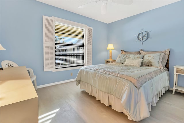 bedroom featuring ceiling fan and light hardwood / wood-style floors