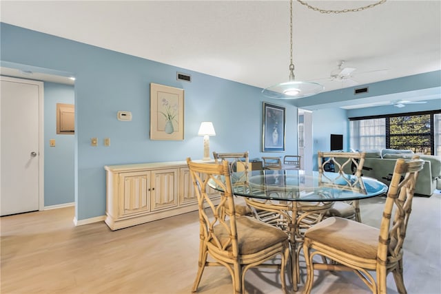 dining room featuring ceiling fan and light wood-type flooring