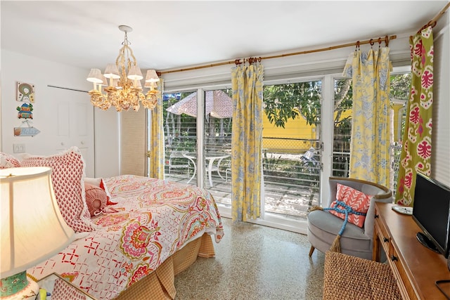 bedroom featuring access to outside and an inviting chandelier