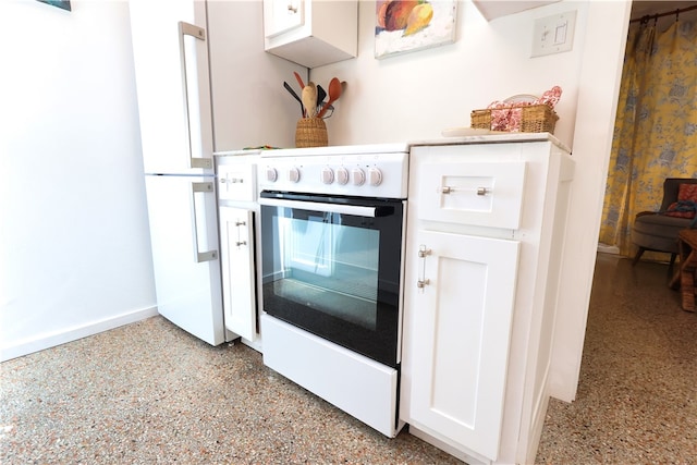 kitchen featuring white cabinetry and white appliances