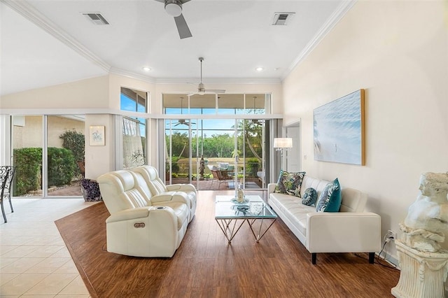 tiled living room with crown molding and ceiling fan