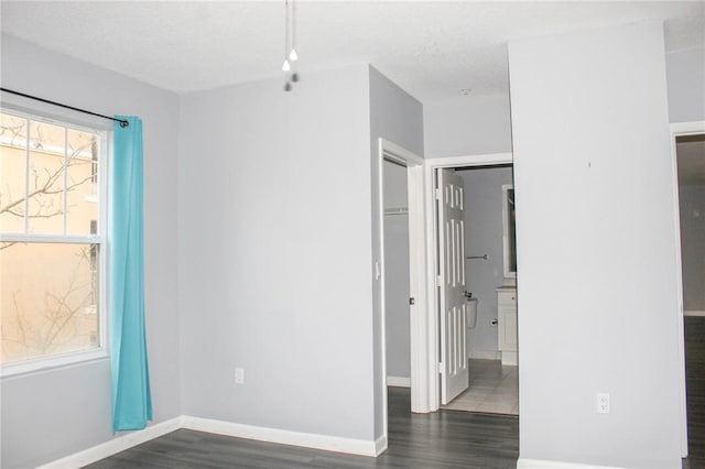 5045 Fairways Cir Unit D201, Vero Beach, FL 32967 - unfurnished bedroom with wood finished floors, a closet, and baseboards