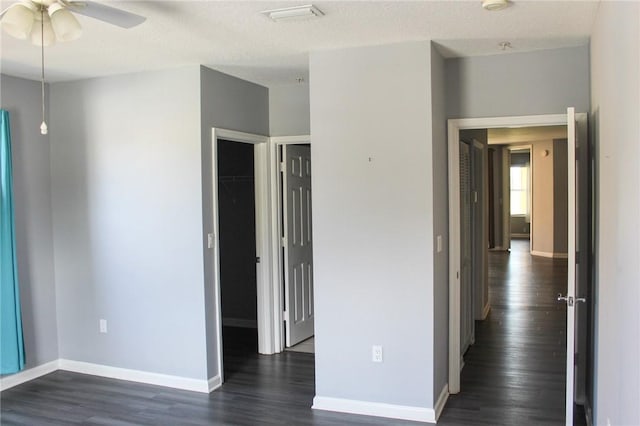 5045 Fairways Cir Unit D201, Vero Beach, FL 32967 - unfurnished bedroom with baseboards, dark wood-style floors, and a closet