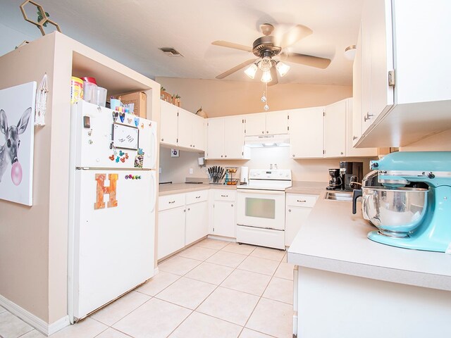 kitchen featuring white cabinets, white appliances, light tile patterned floors, and lofted ceiling