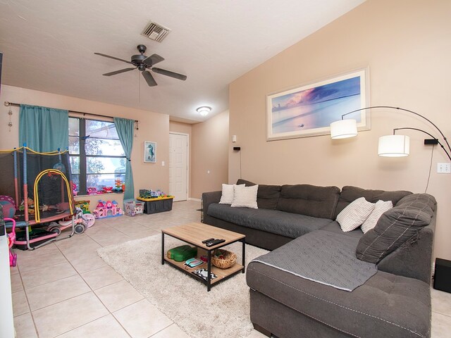 living room featuring ceiling fan and light tile patterned floors