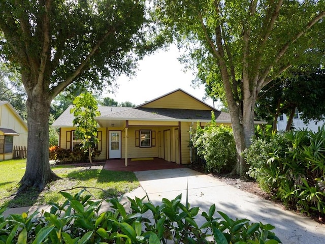 ranch-style house featuring a carport