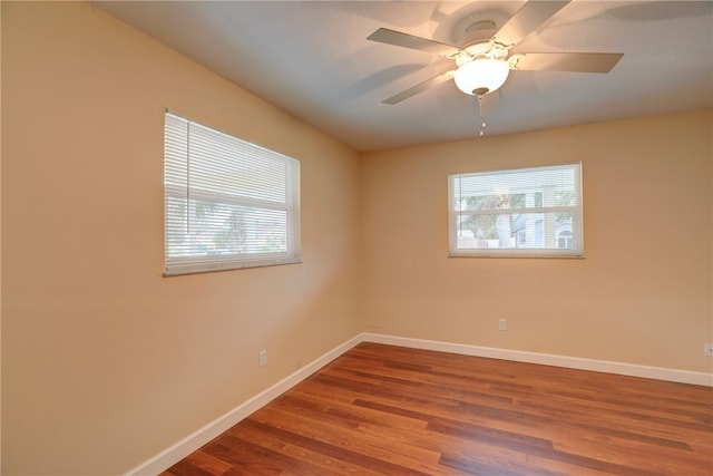 unfurnished room with ceiling fan and wood-type flooring