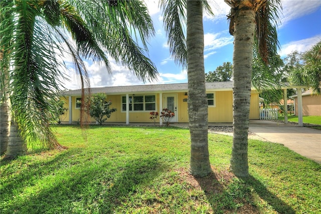 single story home featuring a front lawn