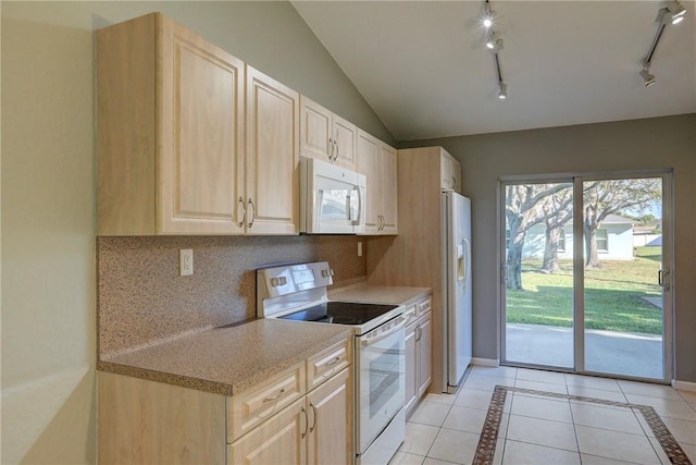 kitchen featuring light brown cabinets, lofted ceiling, light tile patterned floors, decorative backsplash, and white appliances