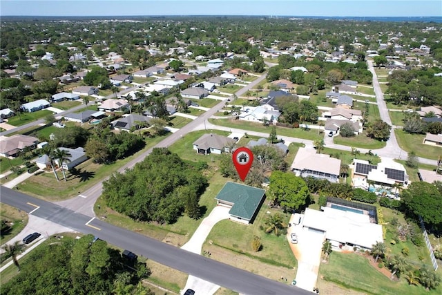 birds eye view of property with a residential view