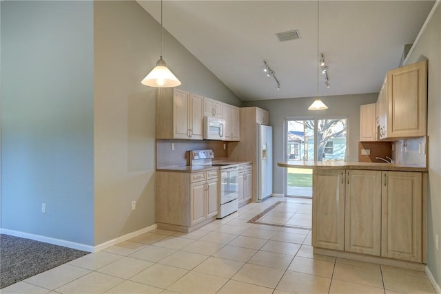 kitchen with visible vents, white appliances, backsplash, and light brown cabinets